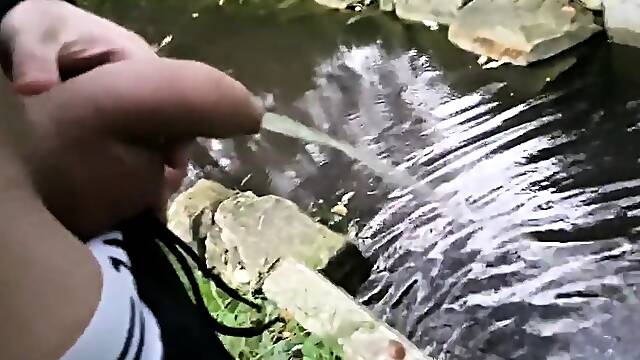 Pissing Outdoors with a Big Cock Twink