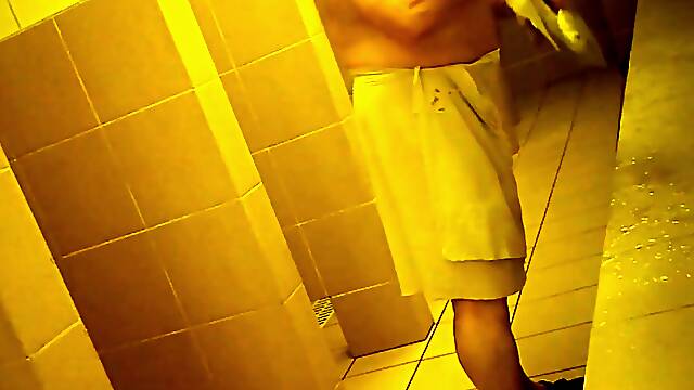 Naked men in public pool shower