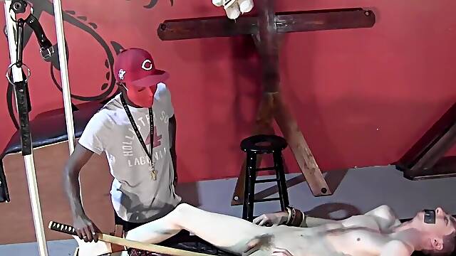 Busting the balls of the submissive man in the dungeon