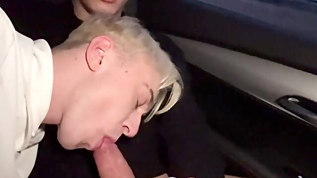 Blonde twink gets filmed on the back seat sucking cock like a slut