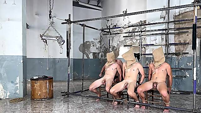 Senior man whips his young male slaves and plays with their dicks in a hot orgy