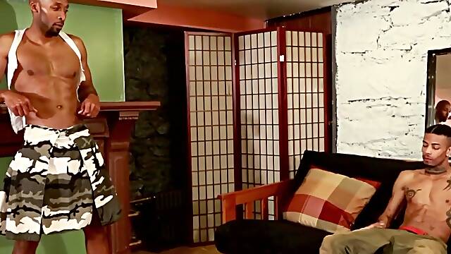 Tattooed ebony twunk enjoys a big fat cock