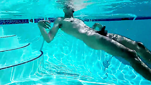 Hairy man jerks off his big wet cock poolside