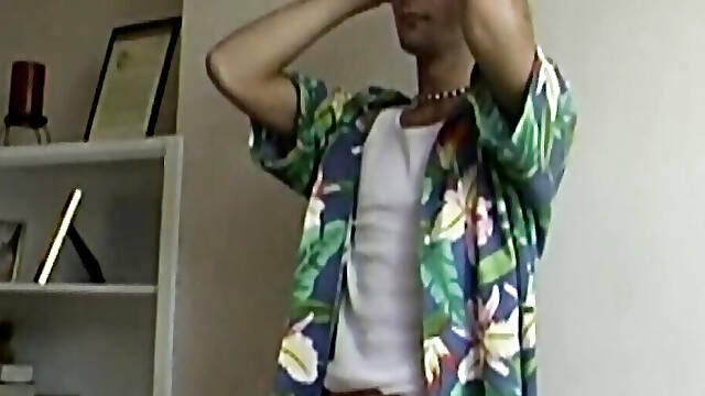 Retro gay stroking his curvy big cock after photoshooting