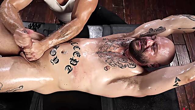 Gagged Muscle Stud Gunnar Gets Chained, Spanked and Edged by Brogan Until He Begs to Cum