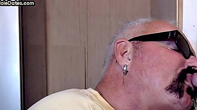 Gay Daddy adores sucking gloryhole penis at his home