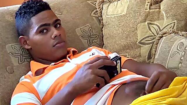 Santiago is on the sofa playing with his big uncut cock, when Ramon spots him from outside and invites himself in. He offers to help his friend out and goes down on Santiago, who is clearly...