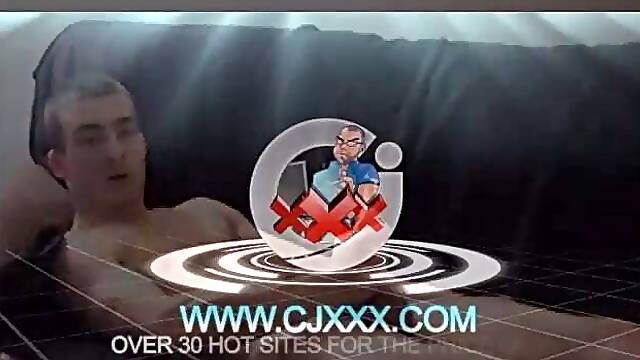 Darrell kicks back on the couch and releases a big cock through his fly. At the same time, he pulls off his dress shirt and tie.