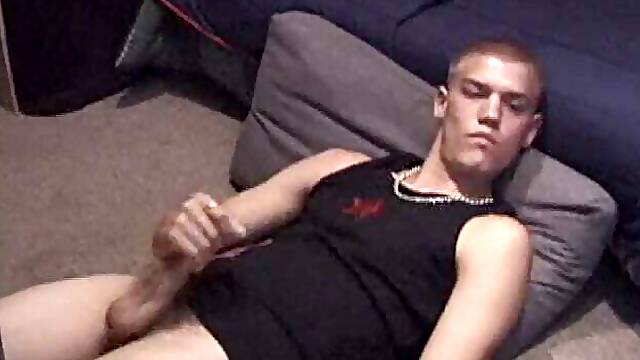 Lance is kicked back, while watching a porn video, as he works up a stiff one. Some determined cock stroking causes a cum explosion onto Lance's shirt, which he quickly licks up.