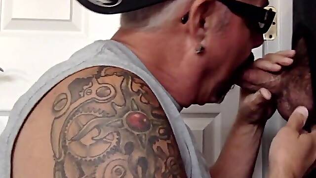 Tattooed oral DILF sucks gloryhole dick till cum in mouth