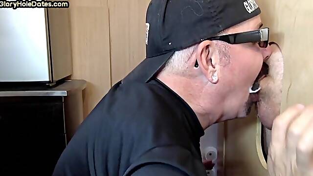 Gloryhole cum loving DILF sucks cock and takes load in mouth