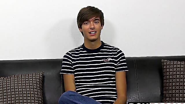 Young dude with bangs pleases himself after the interview