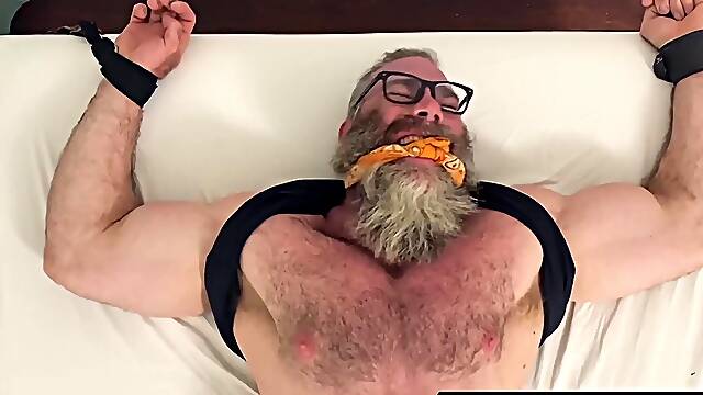 Beefy prisoner suffers tickles everywhere from the cruel dom