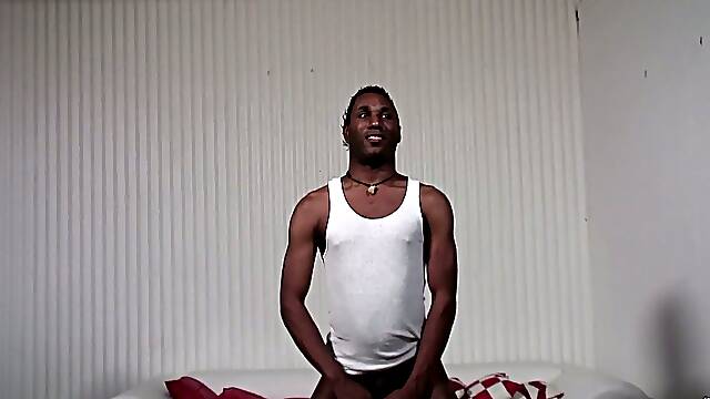 Black guy gets his dick stroked by White dude