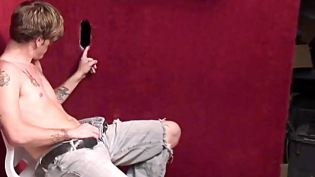 Gloryhole fun with a good looking tattooed gay dude sucking a dick