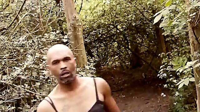 Ebony cum face BBC sissy doxy dude outdoors in the woods wearing pants and petticoat and cums.