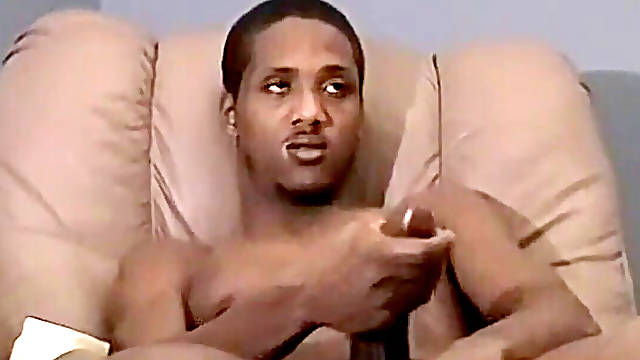 Black guy masturbates his massive man sausage before cumming in mouth