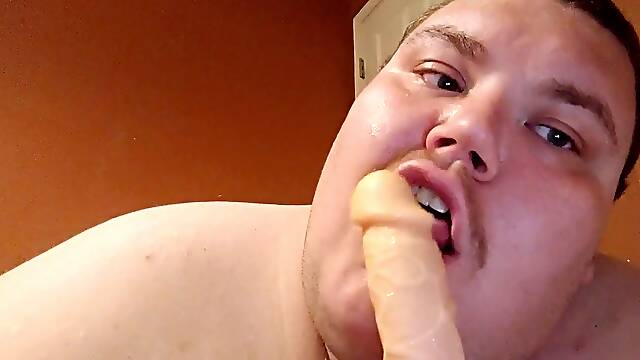Thick guy inhaling a dildo