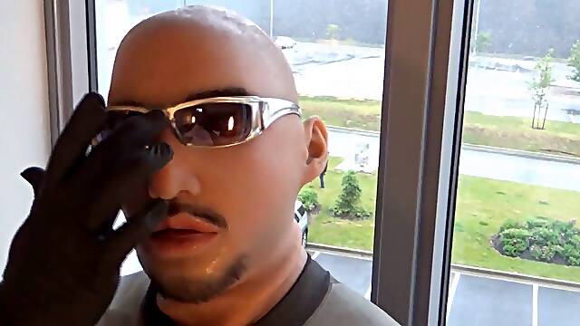 Silicone hooded wetsuited man gets horny at hotel window and pounds his pillows