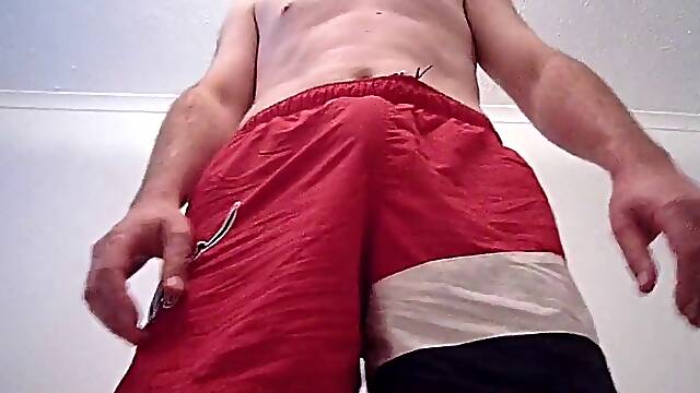 Kudoslong in red shorts toying with his chisel and tugging