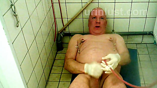 German grandpa jacking of with catheter in urethra