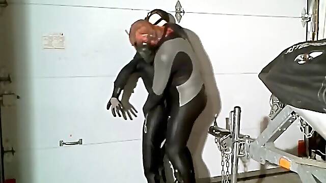 Wetsuited spiderman grabs orca