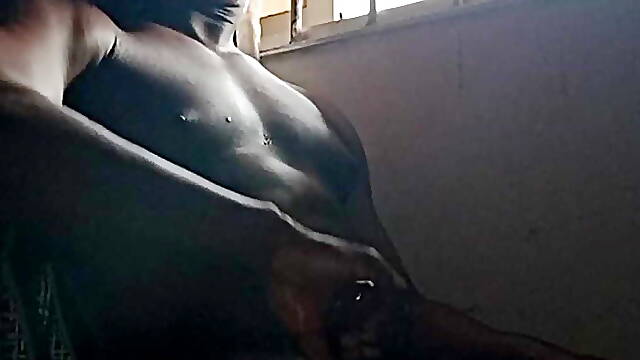 Spiderman jerks off by the window 