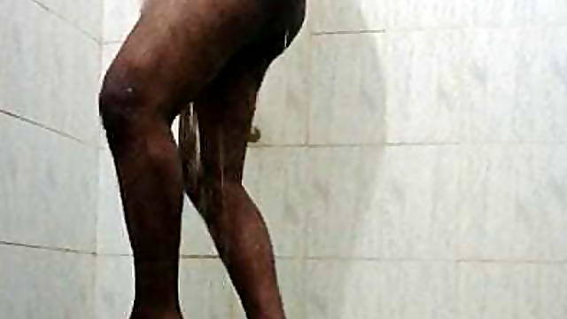 A horny Black Asian guy pissing in underwear and bathing in bathroom 
