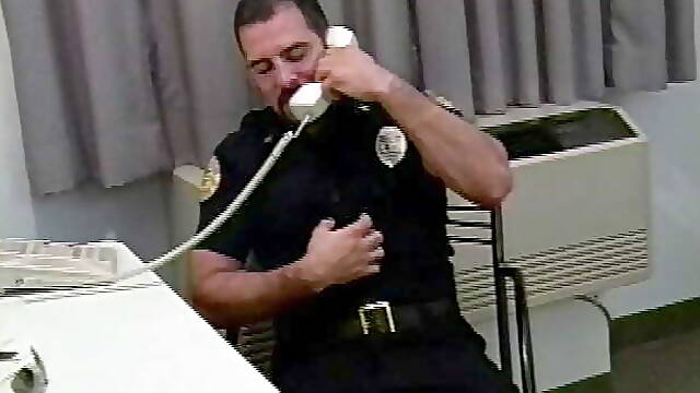 Manly cop fucks a horny gay stud in his office