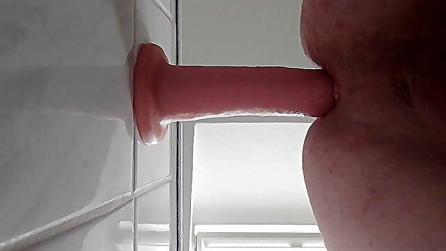 Dildo fucked in the ass with whipped cream
