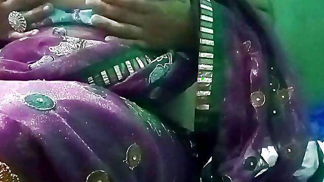 Indian Gay Crossdresser in pink saree pressing and milking his boobs so hard and enjoying the...