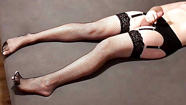 Long legs crossdresser in fishnet stockings lingerie