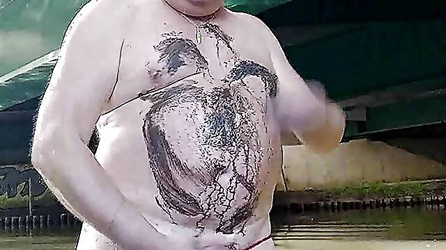 Fat pig Pascal masturbates in the humidity and mud under a bridge