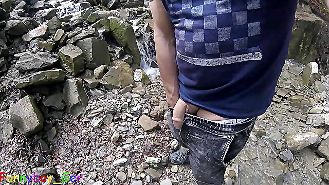 I piss in a mountain stream and then feel like jerking off my cock, despite the risk of getting caught. Outdoor fun in Nature.