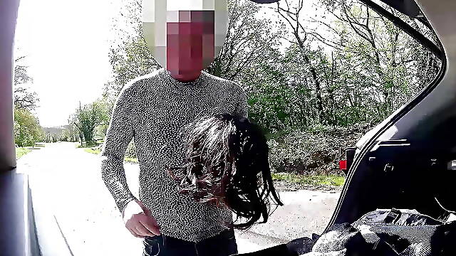 Cross dress changing in public car park as cars drive past