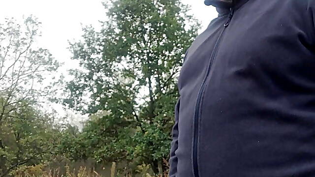 Mastrubbing bear a small cock next to a parking lot