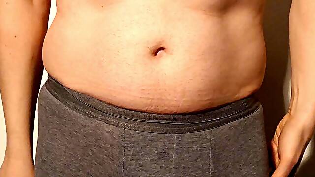 Close up man strips naked and wanks uncut cock until he is erect and gets dressed again