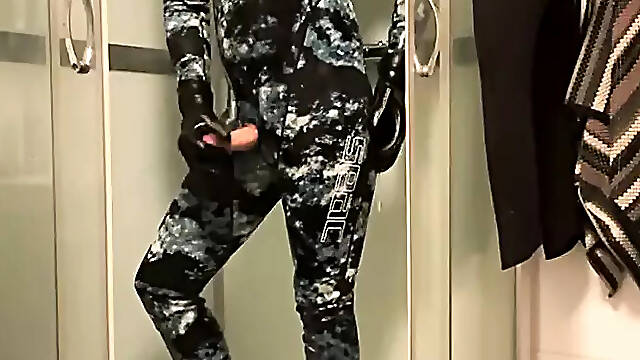 Wetsuit and gasmask in the shower