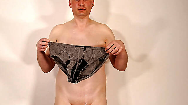 Jonathan pissing his underwear and pisses over his naked body as he masturbates rubbing the pee over his chest and erection