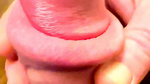 Big shiny cockhead with pink foreskin like a nipple to suck on