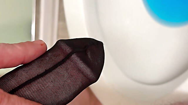 BWC pissing and playing through his cock stocking