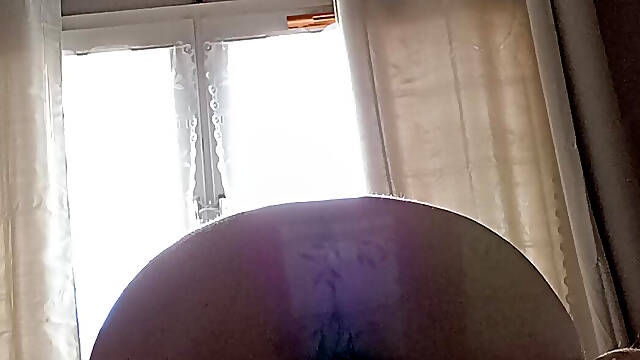 Big of gorze in front of a naked window