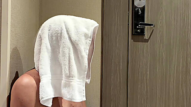 Masturbating totally naked in doorway of hotel room