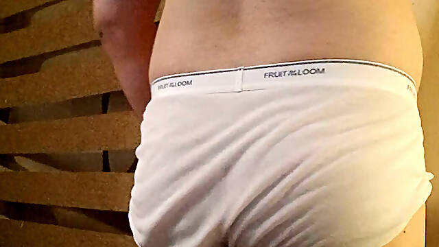 Muscular stud plays with his bulge and nipples