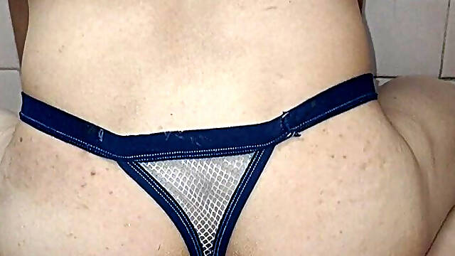 Gay in thong riding homemade dildo