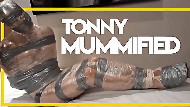 Tonny Mummified in Plastic and Duct Tape - Gay Bondage - Gay Domination - Mummification - Nose Hook - Ball Gag - Gagged - BDSM