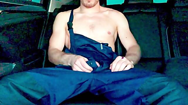 Muscular gay mechanic milks his rock-hard cock